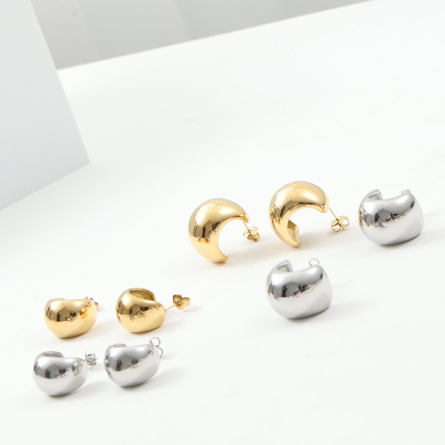 Large Curved Ball Surface Titanium Steel Earrings