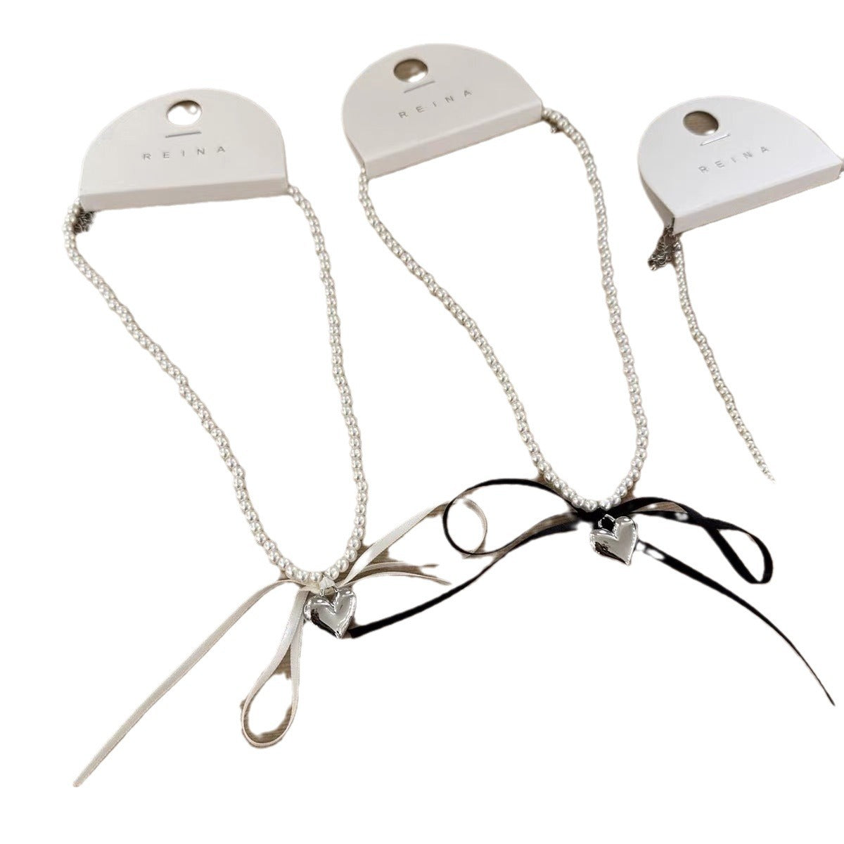 Three-dimensional Metal Love Ribbon Bow Pearl Design Necklaces