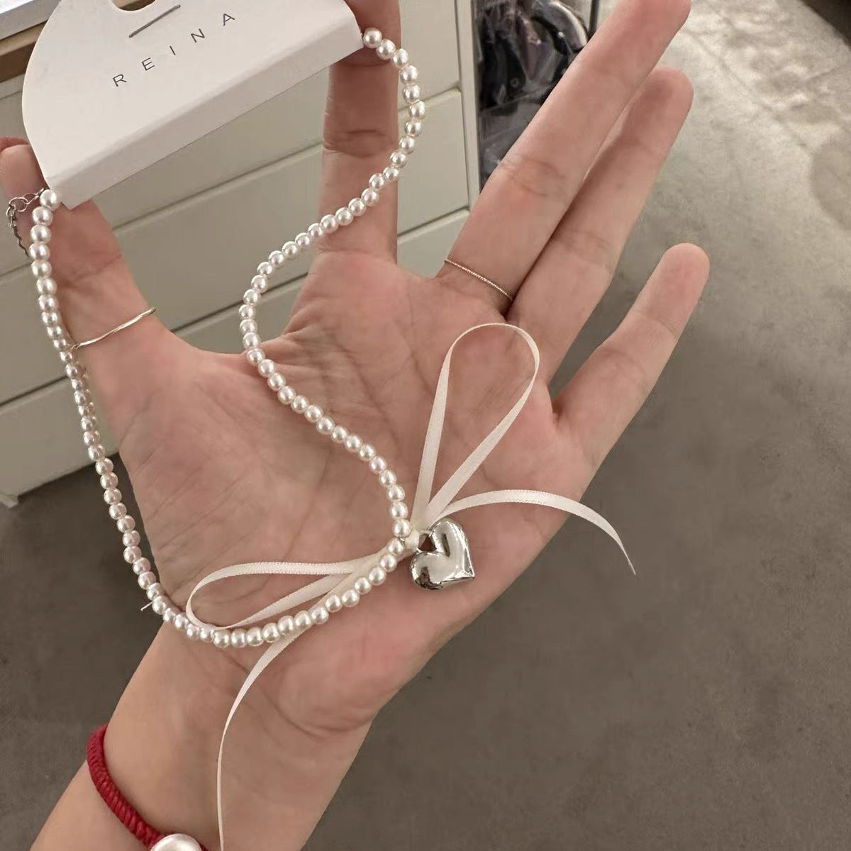 Three-dimensional Metal Love Ribbon Bow Pearl Design Necklaces