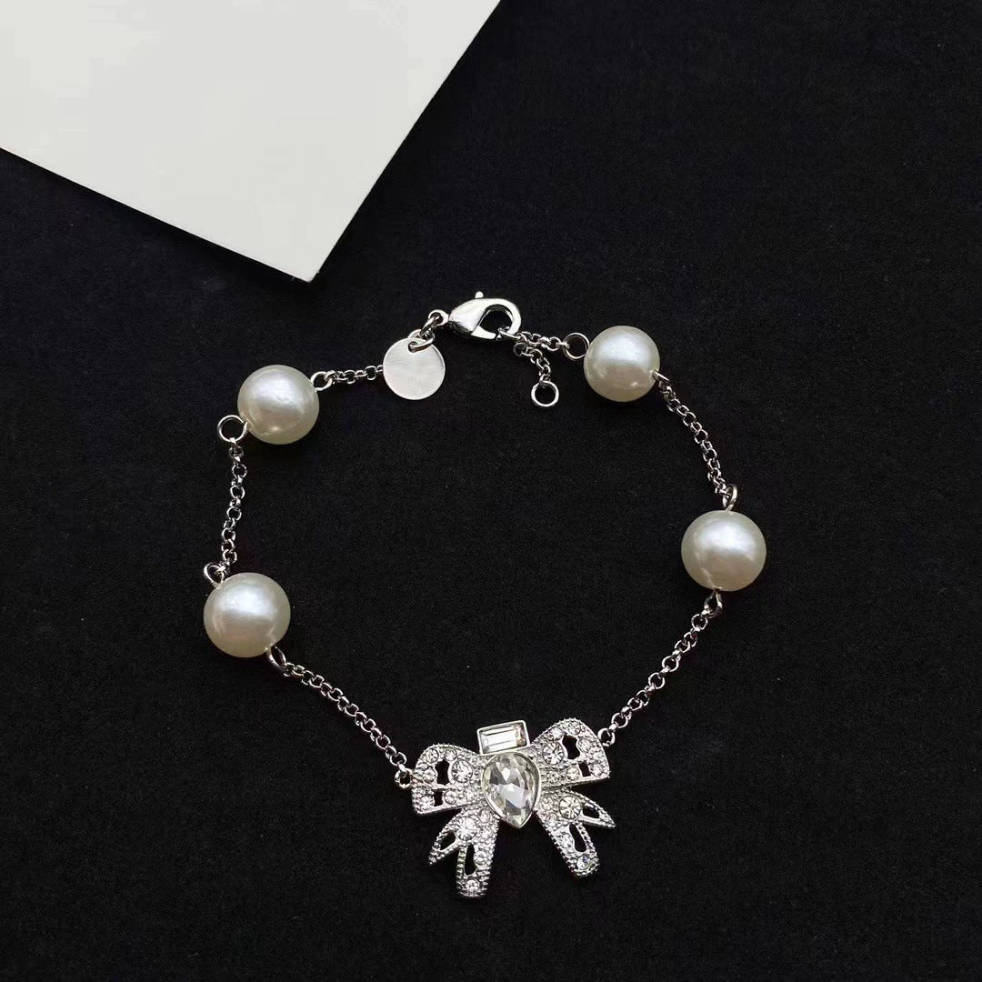 Women's Miao Elegant Bow Pearl French Clavicle Chain Necklaces