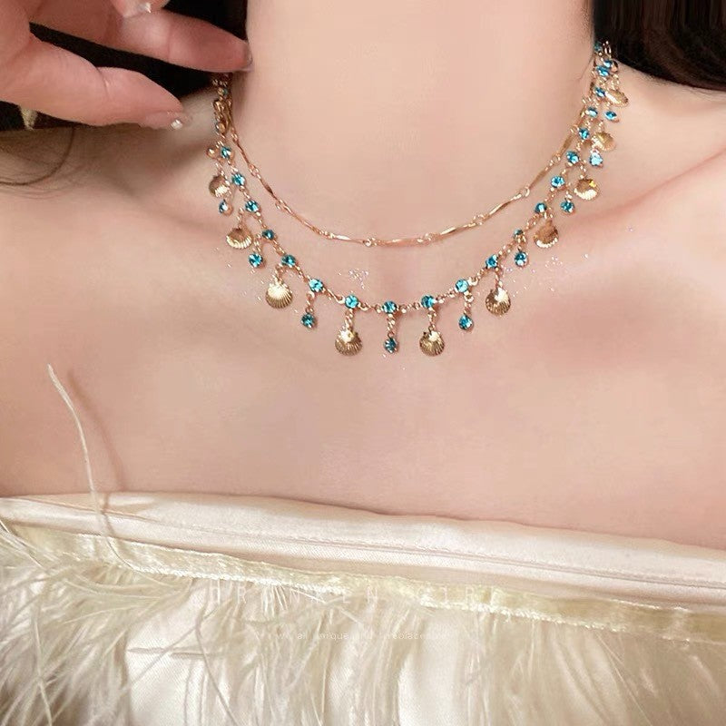 Daughter Of The Sea Blue Zircon Gold Shell Niche Necklaces