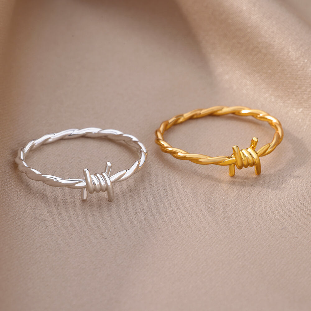 Women's & Men's Wind Simple Hollow Gold-plated Stainless Steel Rings