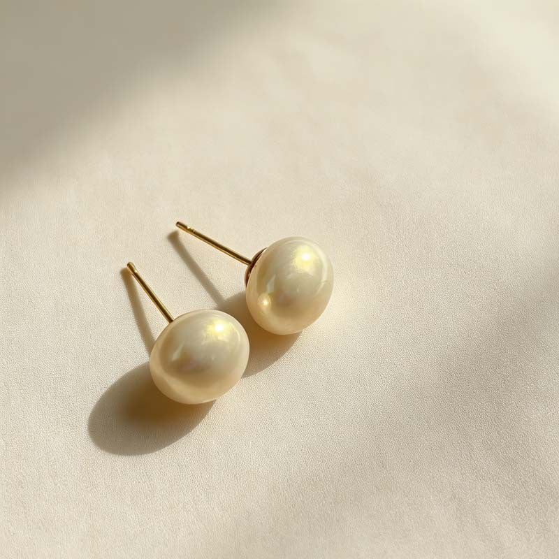 Women's Retro Elegant Champagne Flat Round Steamed Bread Pearl High-grade Niche Stud Earrings