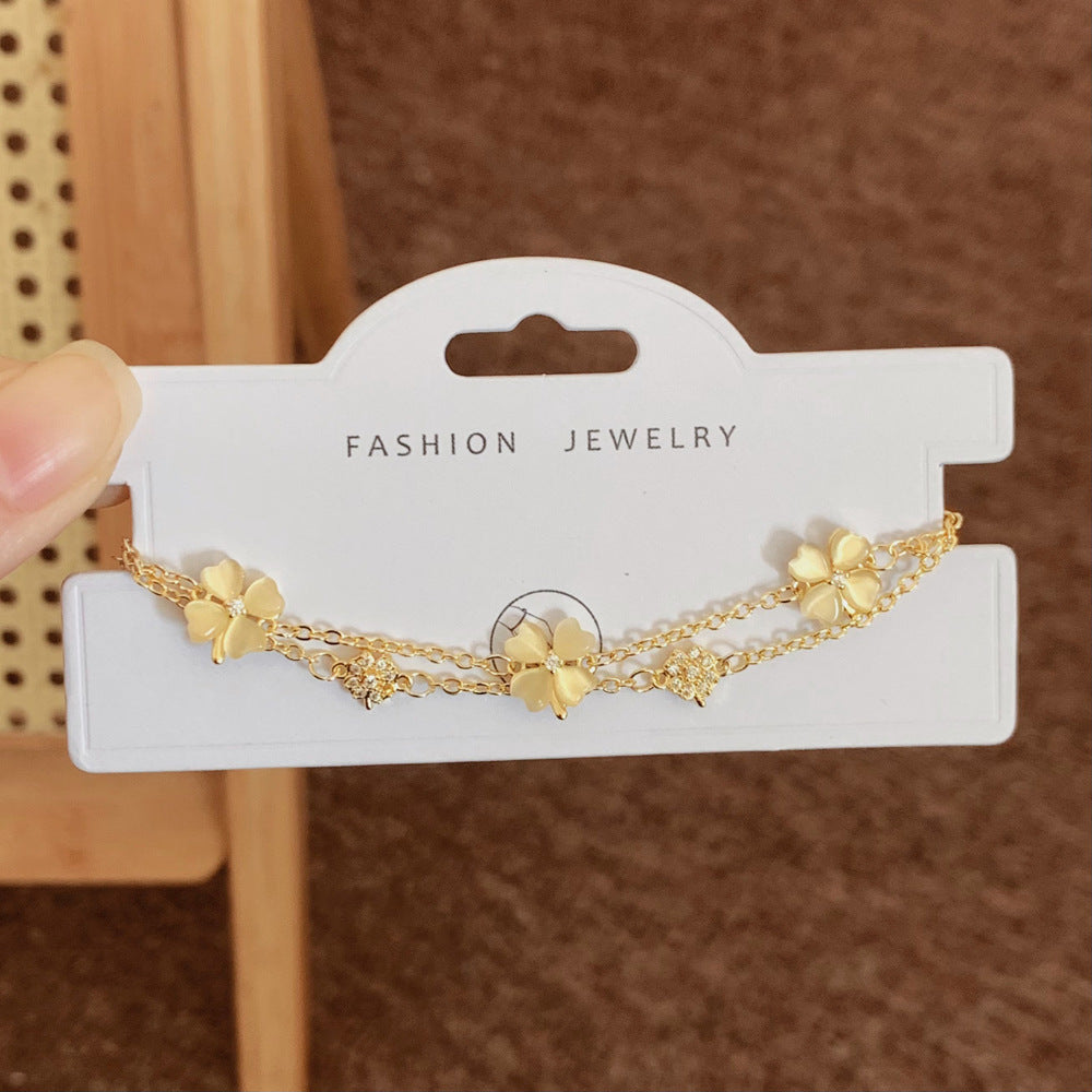 Women's Inlay Fritillary Four-leaf Flower Pull-out Light Luxury High-grade Bracelets