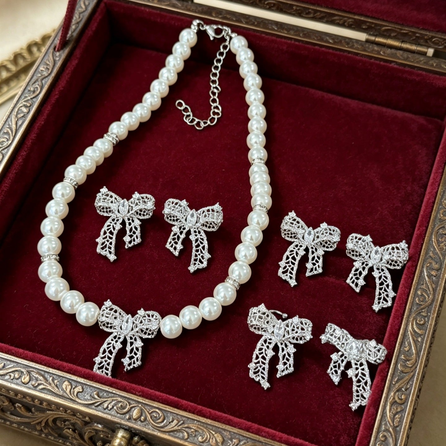 Women's Bow Sier Pearl Ear Clip Hollow Out Niche Zircon Light Earrings