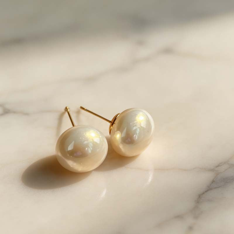 Women's Retro Elegant Champagne Flat Round Steamed Bread Pearl High-grade Niche Stud Earrings
